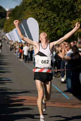 Marathon Runner Crossing The Finish Line